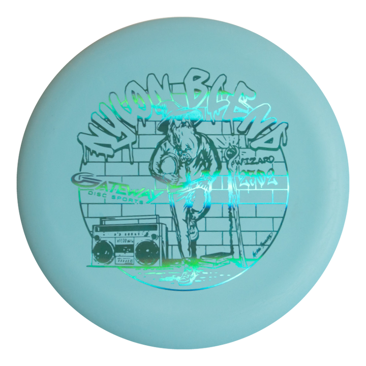 The Wizard - Suregrip Nylon is a light blue stable putter featuring a hoodie-clad figure holding a disc, brick wall, boombox, and the text €œWYLDBLEMS€� and €œGateway Disc Sports Wizard€�€”ideal for mid-range drives.