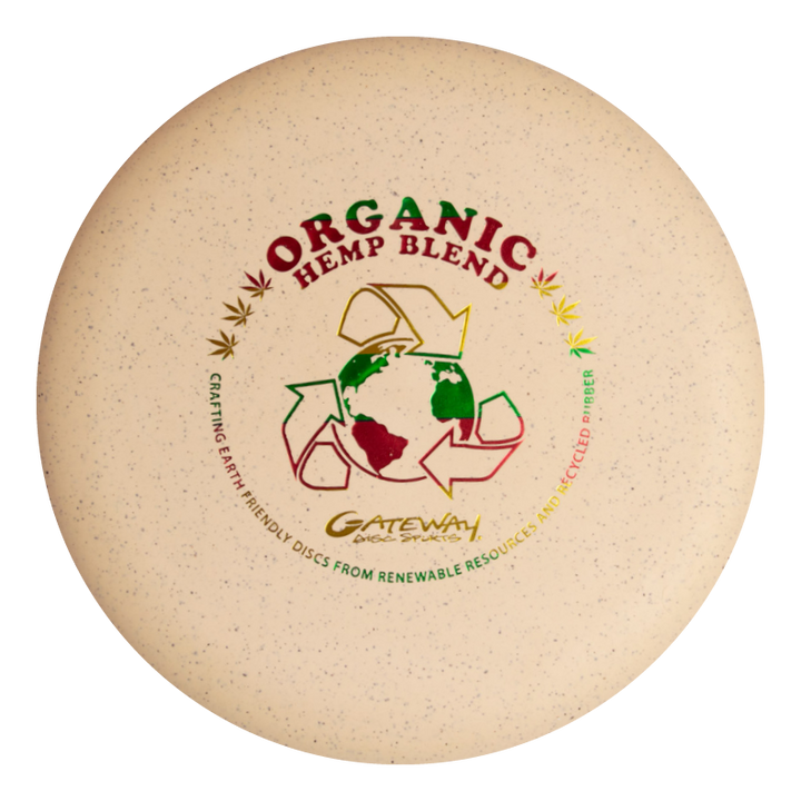 The Wizard - SS - Hemp is a beige disc golf disc labeled "Organic Hemp Blend," with globe and recycling graphics, promoting Gateway Disc Sports' eco-friendly materials€”ideal as a reliable mid-range or stable workhorse putter.