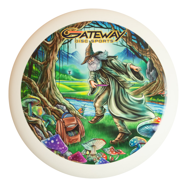 A wizard plays disc golf in a vibrant mushroom forest with colorful trees. The Wizard - Vivid Color #4 disc showcases the Gateway Disc Sports logo at the top.