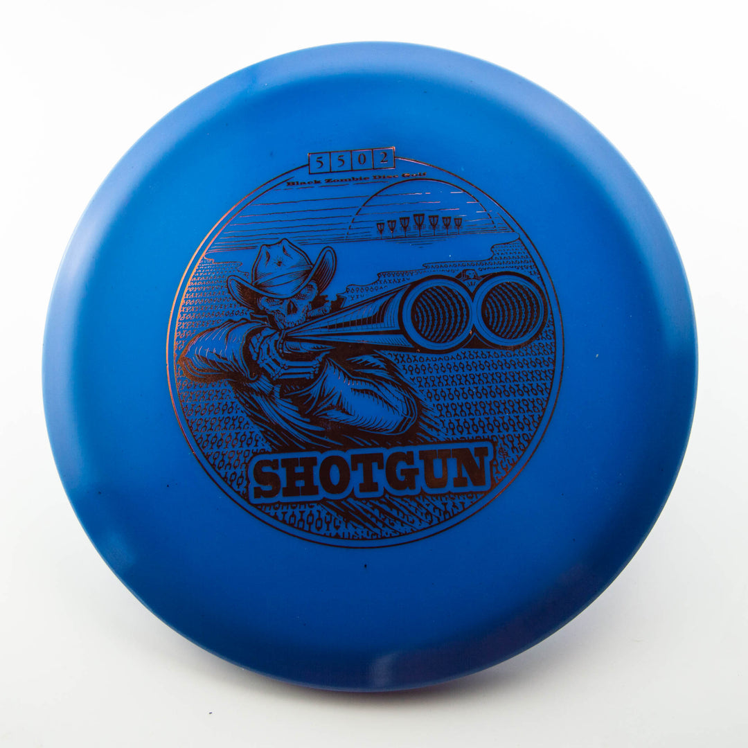 A Black Zombie Shotgun — Platinum disc golf disc featuring an illustration of a cowboy aiming a shotgun with clay targets in the background.