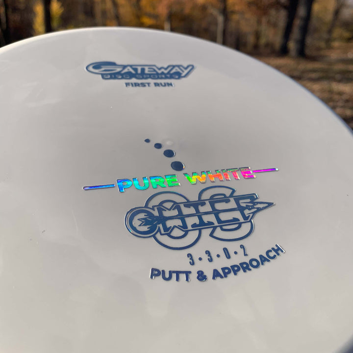 Close-up of a white Gateway Disc Sports Chief OS - Pure White putter in Premium Suregrip Plastic, first run, with flight numbers 3|3|0|2 and "Putt & Approach" printed on it.