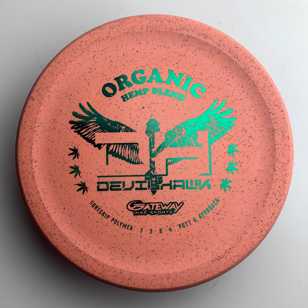 A pink speckled Devilhawk - Suregrip Hemp disc golf putter by Gateway, featuring green foil text, "Organic Hemp Blend," and an over-stable profile.