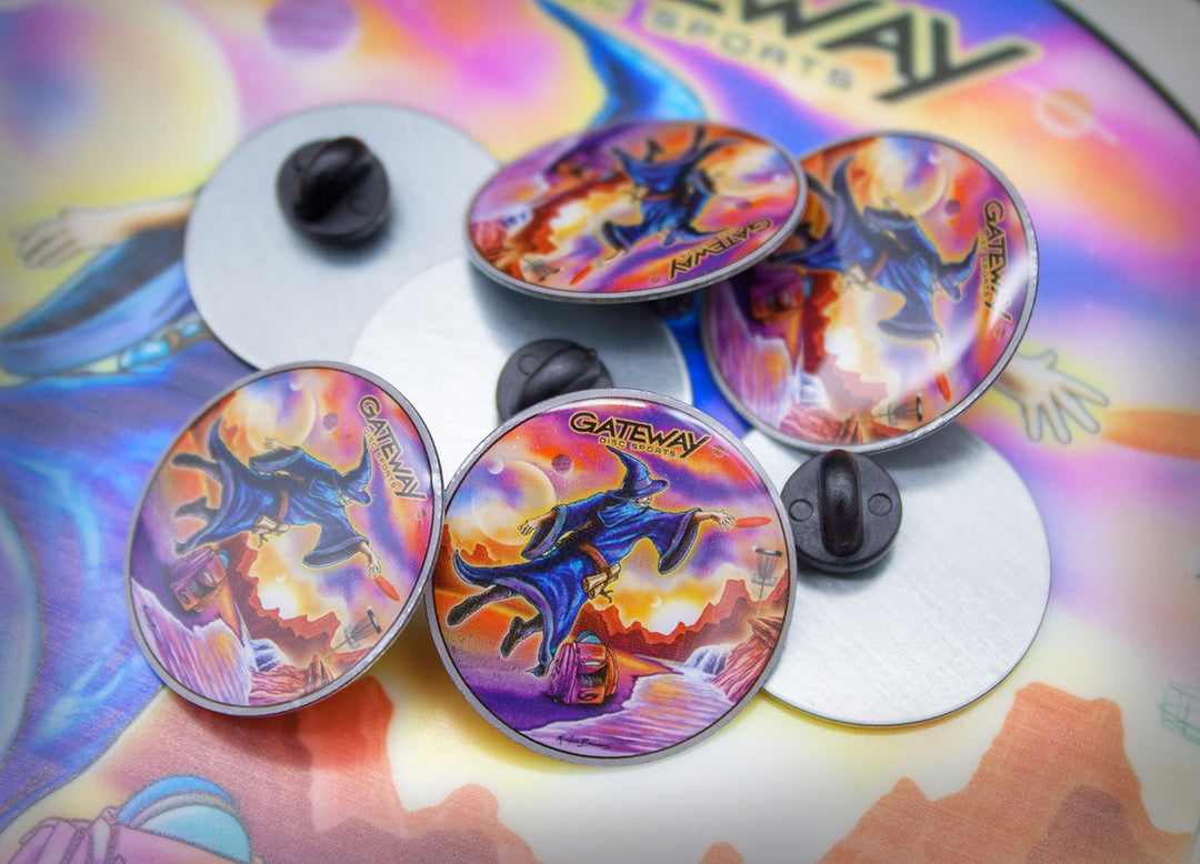 Five round Hat Pins with a wizard design and "GATEWAY" text are shown on a colorful background, highlighting both the detailed front artwork and plain metal backs—a magical tribute to Wizard Jump Putting by Mike Barnard.
