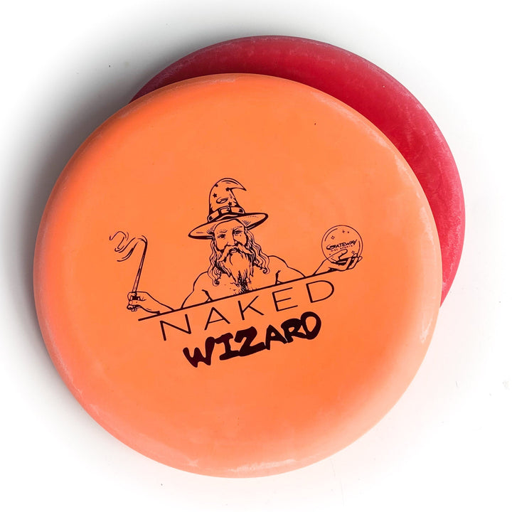 Two stacked disc golf discs: the top is an over-stable orange "Wizard - NAKED - SS" with a wizard graphic, while the red bottom disc makes this set ideal for serious disc golfers and fans of the Naked Wizard design.