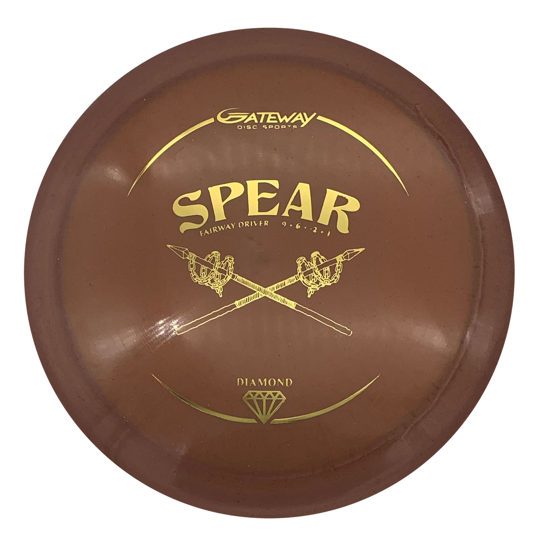 A brown Spear - Diamond disc golf straight control driver by Gateway, featuring crossed spears graphic and "Diamond" plastic marking, viewed from above.