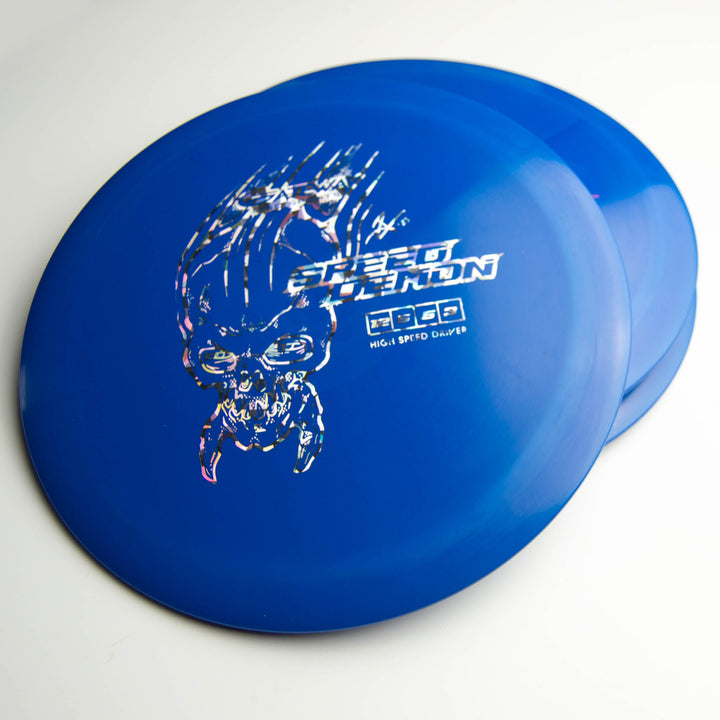 Two blue Speed Demon - Cobalt distance driver discs with a white skull design, partially overlapping on a white surface.