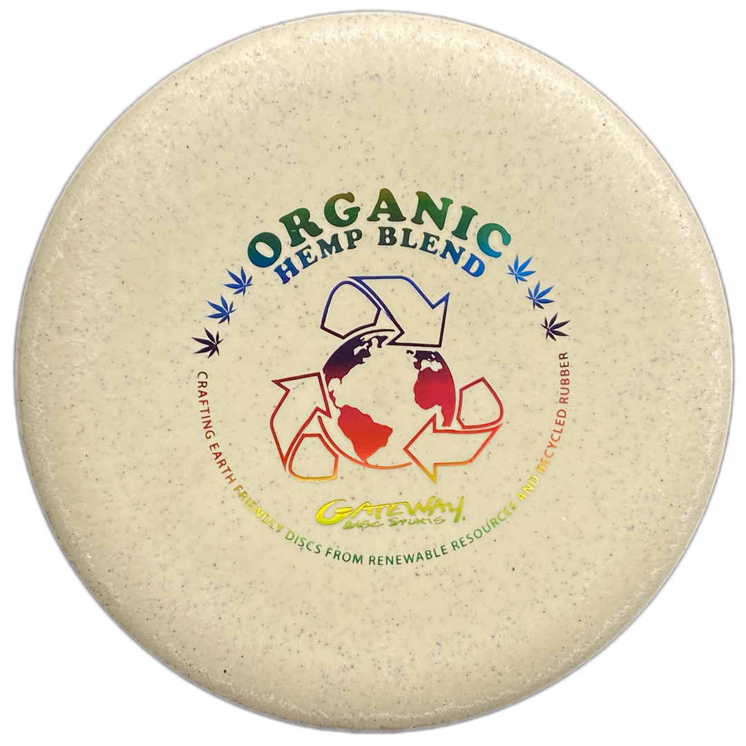 The Warlock - Organic Hemp (H-SS) is a round disc with a speckled texture, —Organic Hemp Blend—� text, and a recycling symbol around the earth. Crafted from organic hemp for eco-friendly play and to enhance your approach game.