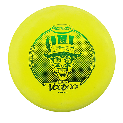 A yellow Voodoo - Suregrip - SS putter disc with a green illustration of a grinning man in a top hat and the text €œVoodoo€� and €œGateway Disc Sports.€�.