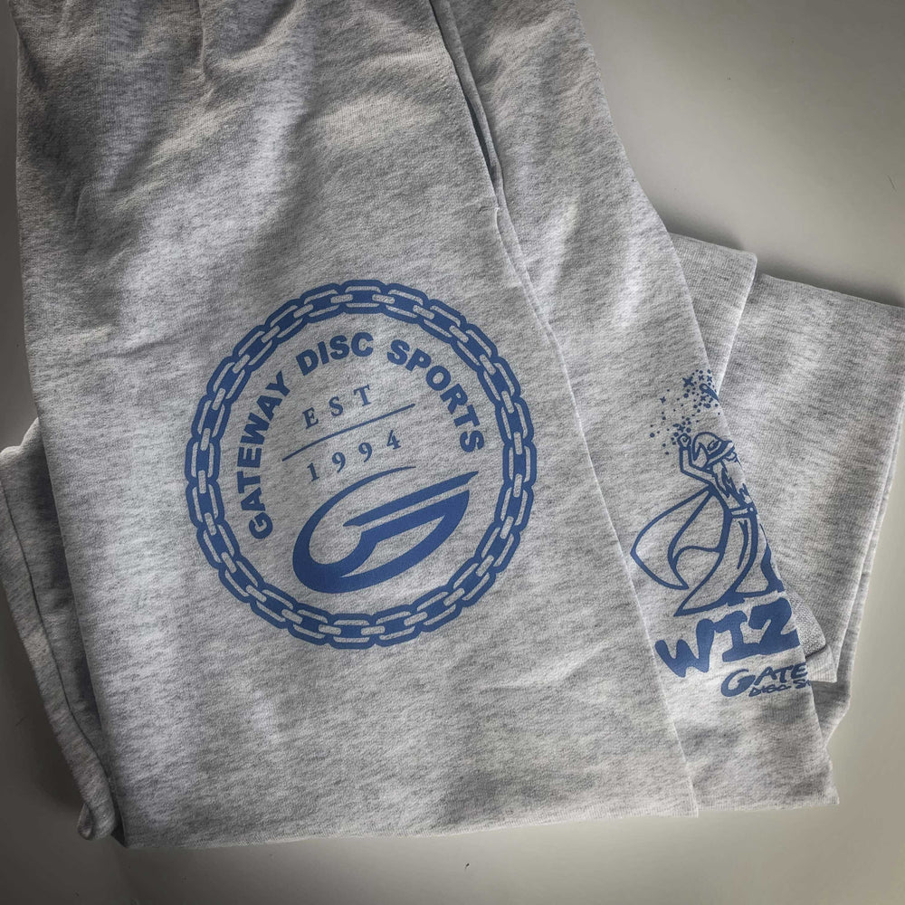 Gateway Joggers: Gray fleece pants with a blue Gateway logo, chain border, and "EST 1994" on one leg, plus a wizard graphic and bold "WIZ" text on the other.