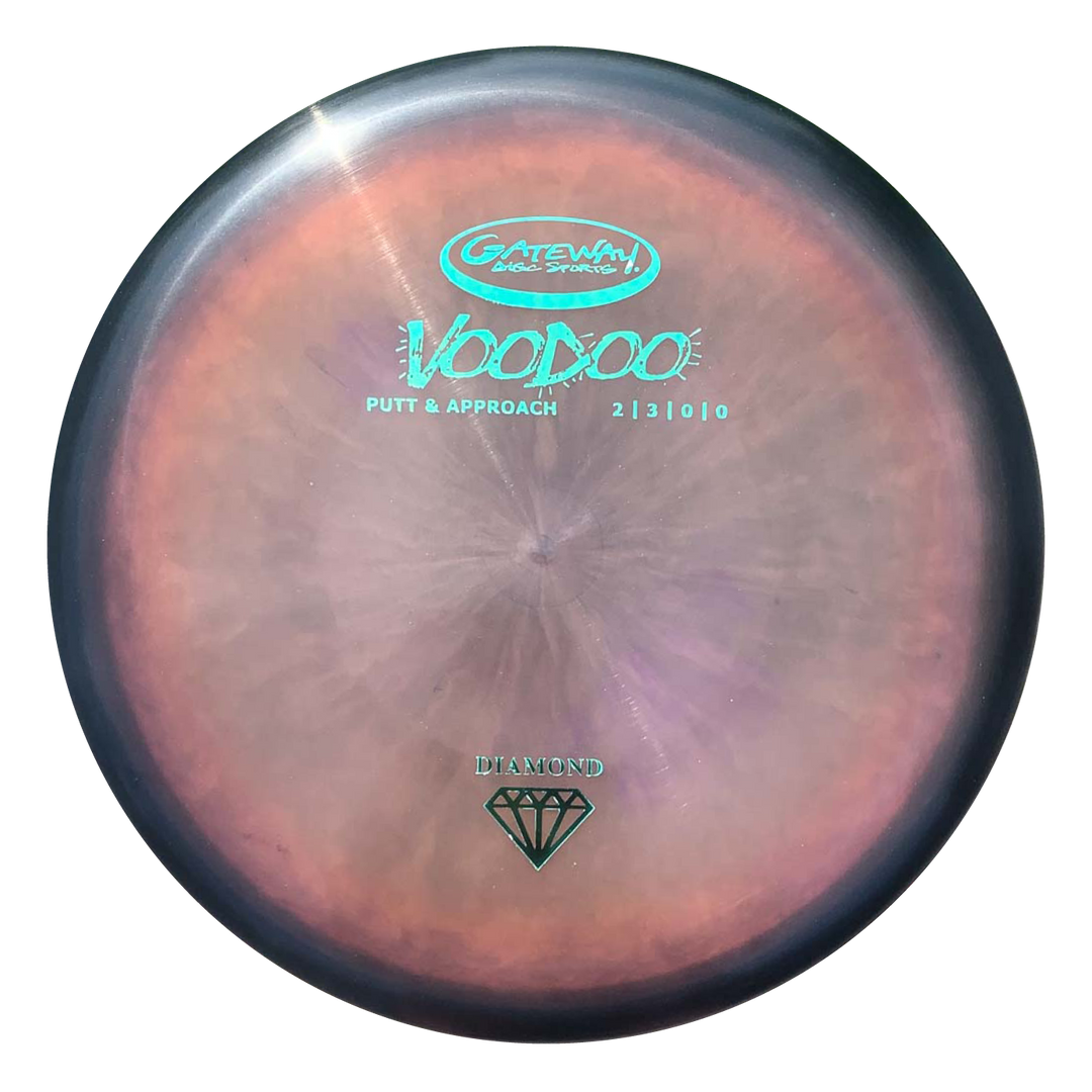 The Gateway Voodoo - Diamond is a marbled putt and approach disc featuring turquoise and black text with a diamond symbol, designed for comfortable grip and straight, reliable lay-ups.
