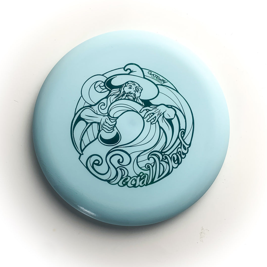 The Wizard - Special Blend is a light blue disc golf putter featuring a Wizard with a staff and —Special Blend—� text—ideal for fans of stable workhorse putters or collectors of Special Blend Wizards.
