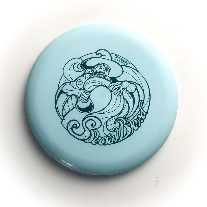 The Wizard - Special Blend is a light blue disc golf putter featuring a Wizard with a staff and —Special Blend—� text—ideal for fans of stable workhorse putters or collectors of Special Blend Wizards.