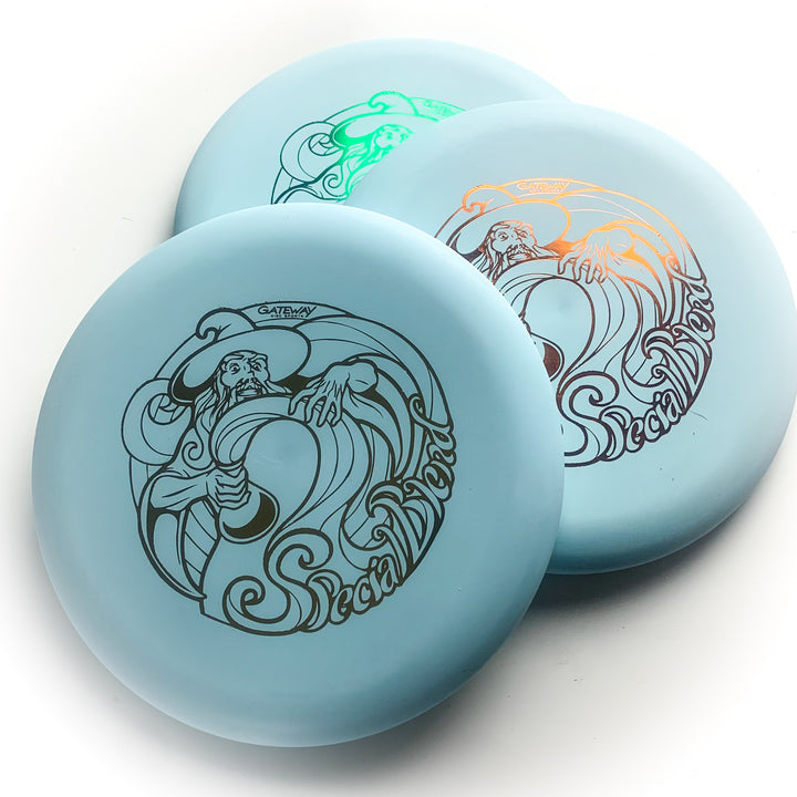 Three Wizard - Special Blend disc golf discs, featuring a wizard design and "Special Blend" print, are arranged overlapping on a white surface—ideal as your stable workhorse putter.